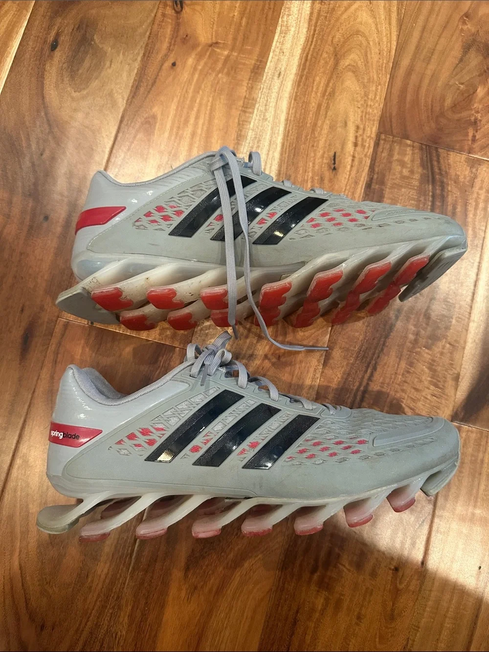 adidas Men's Light Gray Athletic Shoes with Black Stripes and Red Accents